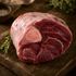 bison osso buco raw on a wooden cutting board with herbs and salt in the background