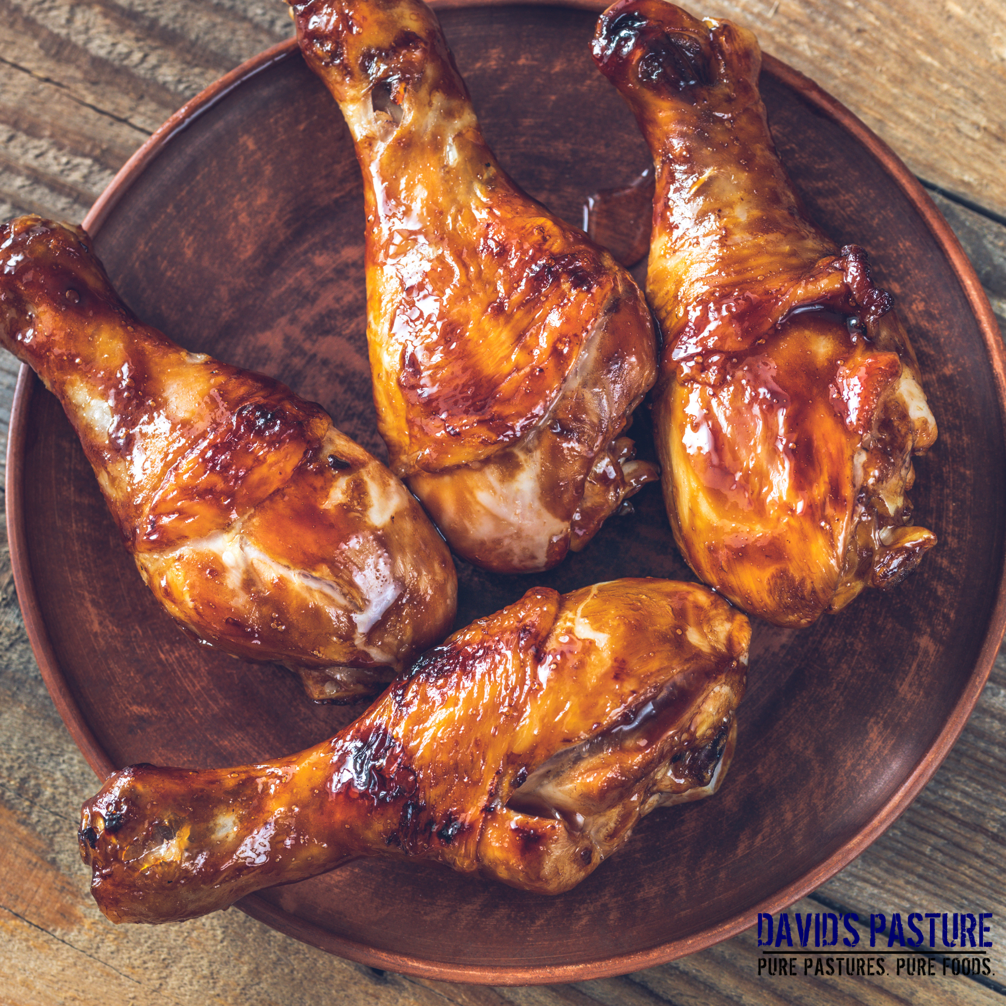 Roasted pasture-raised chicken drumsticks served with herbs