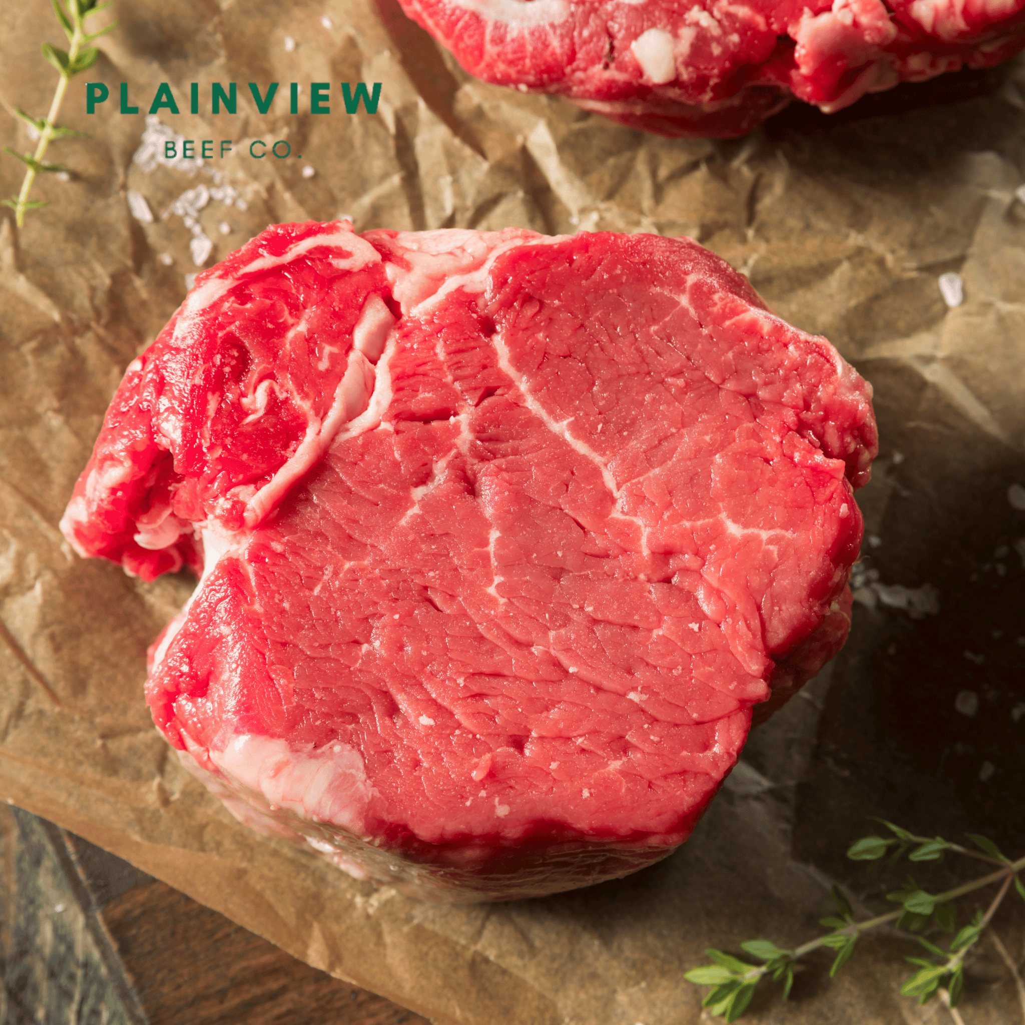 Raw beef on brown paper with 'Plainview Beef Co.' branding